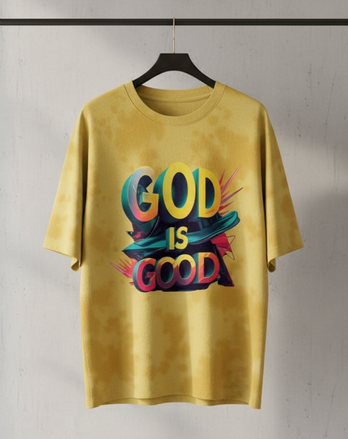 Yellow t-shirt with 'GOD IS GOOD' text on a hanger against a plain background